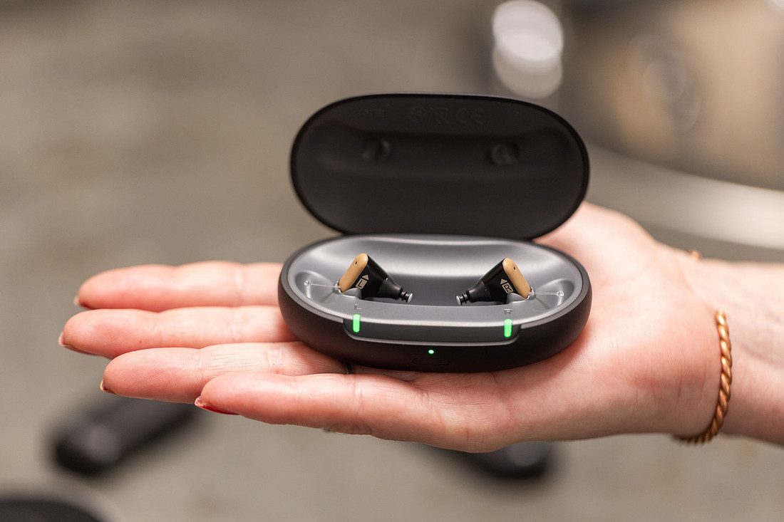 Rechargeable hearing aids in their charging case